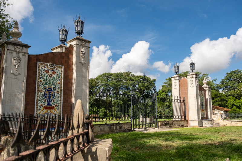 Wide shot of the gates of the Miraflores Garden with ceramic Talavera art on each side of the gate