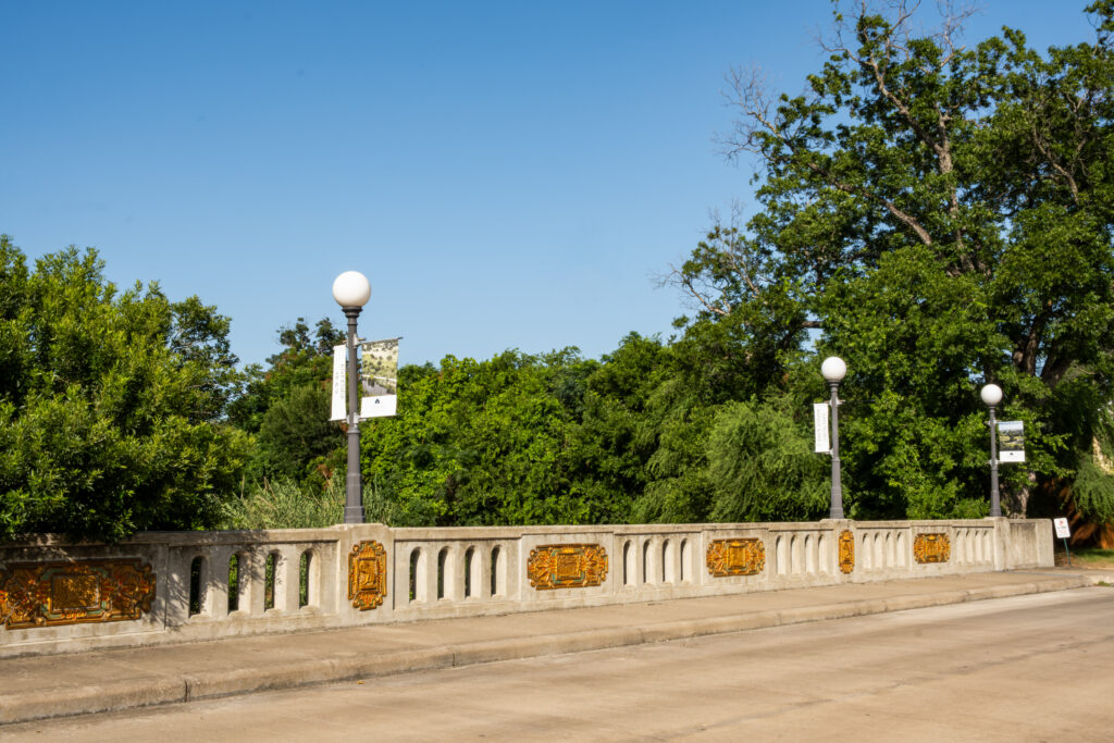 Mill Race Bridge ceramic panels installed on bridge guardrails by Diana Kersey near Golf Course