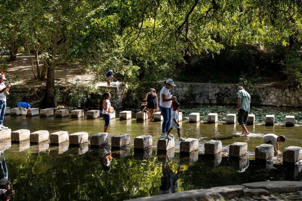 family walking across low-water crossing