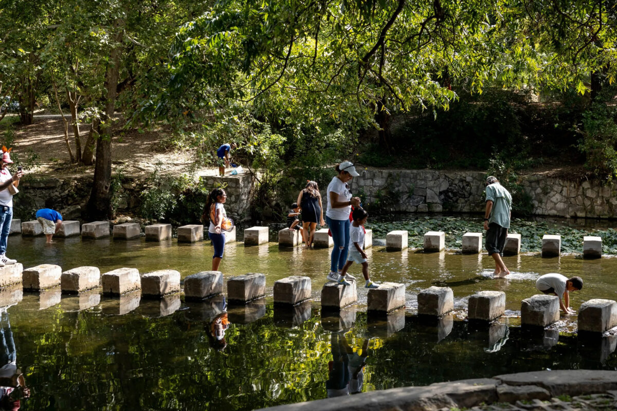 family walking across low-water crossing