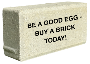 Brick with inscription that reads "Be a good egg, buy a brick today"