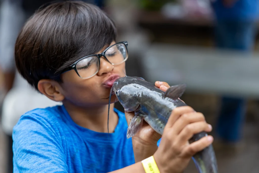 family-fishing-day-boy-with-fish